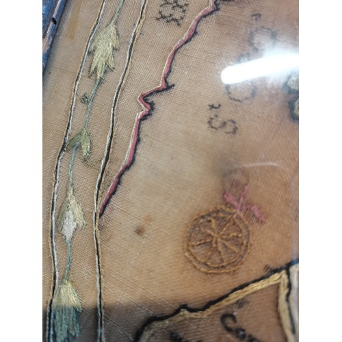 23 - George III oval needlework map sampler of England and Wales dated 1786.  H 36cm W 33cm.