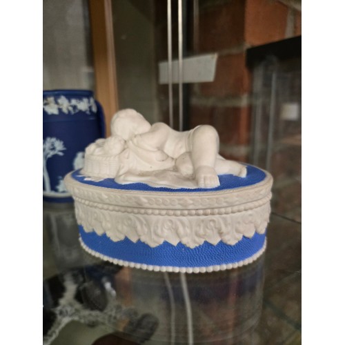 161 - A collection of Jasperware, including a Wedgwood mantel clock, sugar bowl, jug and dish