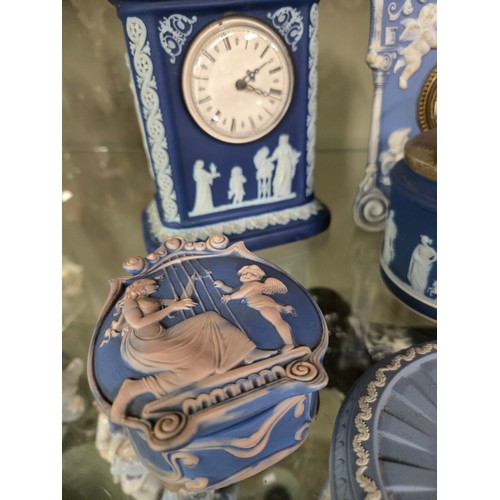 161 - A collection of Jasperware, including a Wedgwood mantel clock, sugar bowl, jug and dish