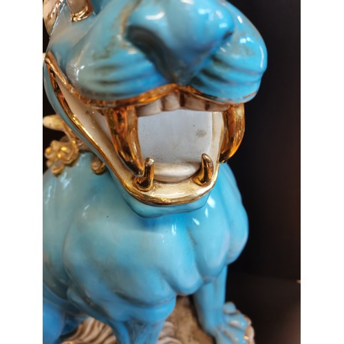 26 - A pair of Chinese Turquoise blue large ceramic Foo Dog Statues. H 58cm W 24cm D 39cm