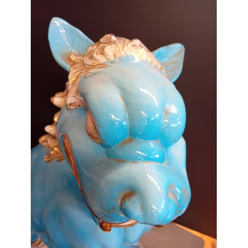 26 - A pair of Chinese Turquoise blue large ceramic Foo Dog Statues. H 58cm W 24cm D 39cm