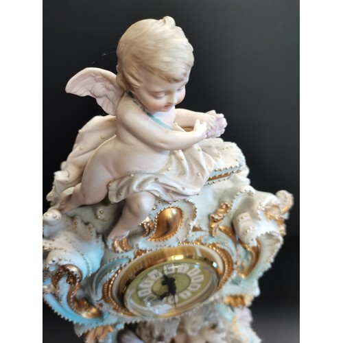 32 - Continental porcelain mantel clock.  Rococo style gilded details and figural sculptures.  Mercedes c... 