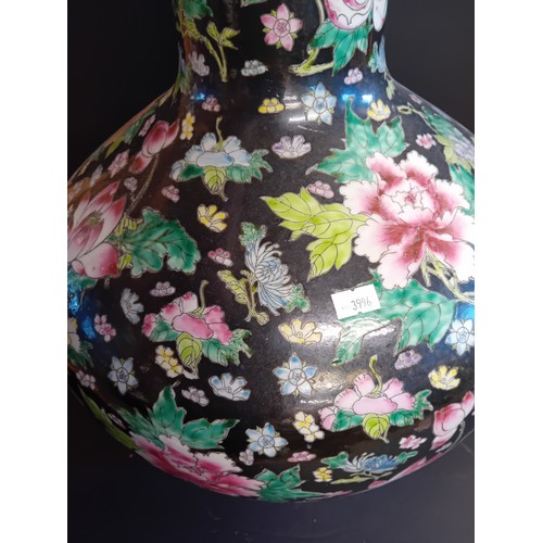 34 - A large Chinese Famille Noire bottle neck vase, 53cm high