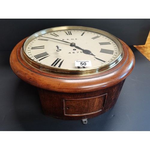 50 - British Railways (North Eastern) mahogany cased wall clock.  Complete with pendulum and key.  Stampe... 