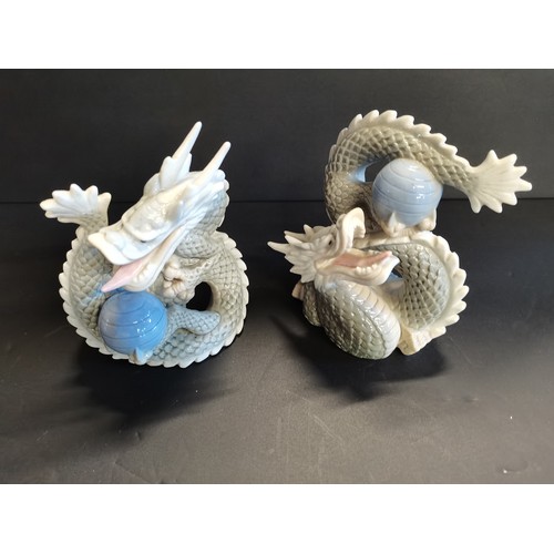 55 - A Pair of Vintage Royal Crown Derby Peacocks H21cm plus Four vintage Yoshimi K porcelain foo dragon ... 