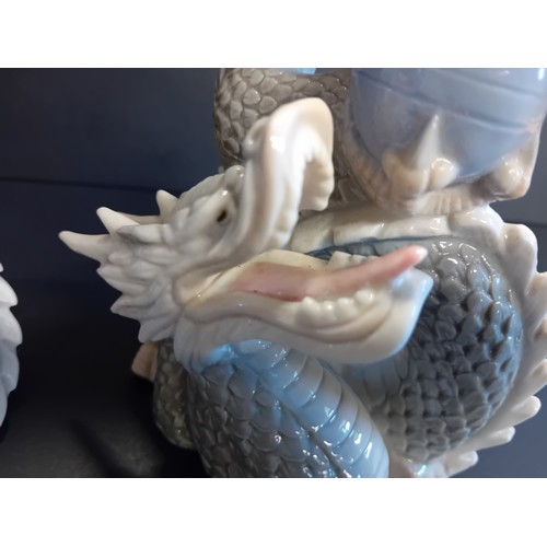 55 - A Pair of Vintage Royal Crown Derby Peacocks H21cm plus Four vintage Yoshimi K porcelain foo dragon ... 