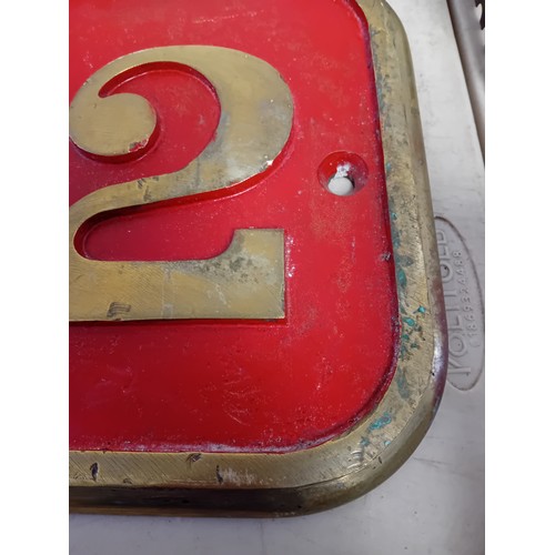 690 - Vintage sign with brass border and raised numbers 