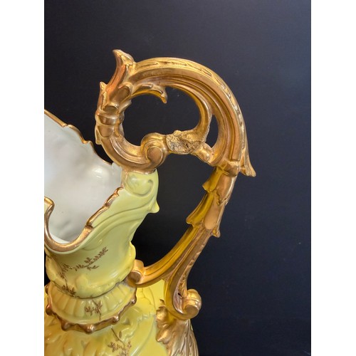 82 - A Royal China Works yellow and gilt decorated ewer, 43cm high.. Grainger works late 19th century 
( ... 