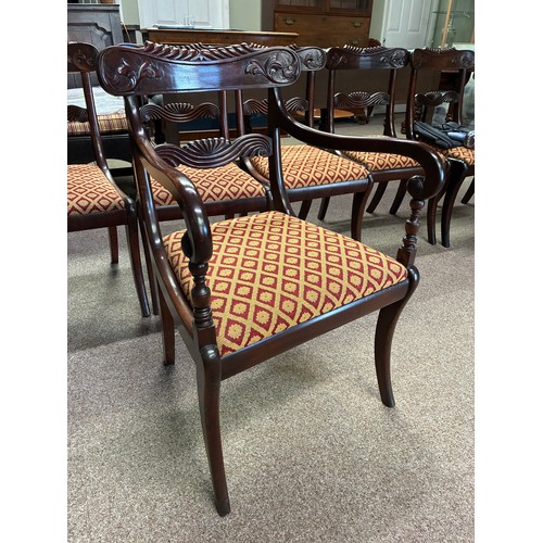 623 - A set of Regency mahogany dining chairs comprising six chairs and two carvers, with carved and shape... 