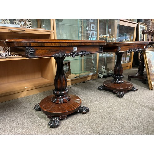 598 - A pair of William IV rosewood pedestal card tables, having a carved frieze above swept support on ci... 