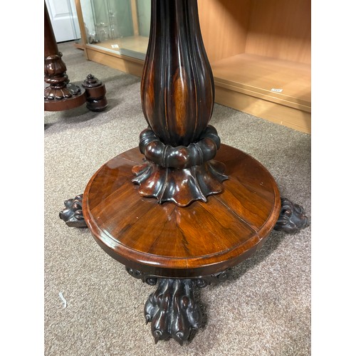 598 - A pair of William IV rosewood pedestal card tables, having a carved frieze above swept support on ci... 