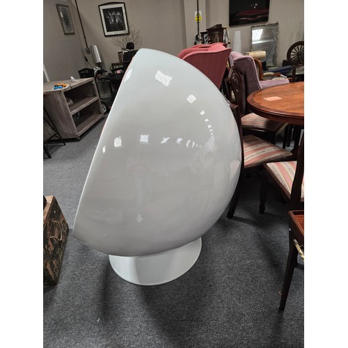 807 - An Iconic Mid Century Eero Aarnio ball chair features glossy white fiberglass shell with vibrant ora... 