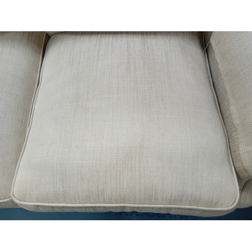 869 - A Laura Ashley 2 seater settee in a deep gold textured fabric sat on turned wooded legs with brass c... 