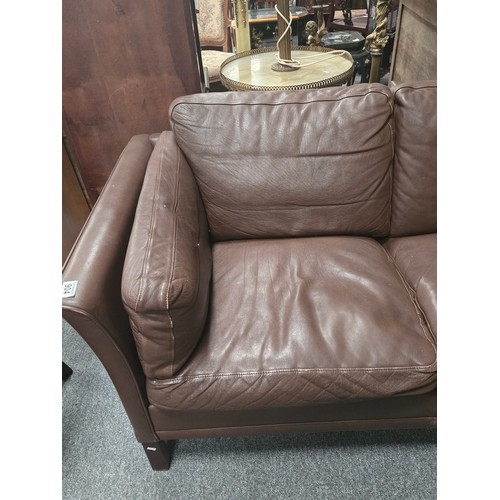 885 - A Mid-century Danish chocolate brown leather three seater settee. W216cm