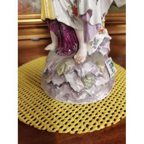 85 - A Meissen style continental figure group of a woman and child, the woman's arms supporting a pierced... 