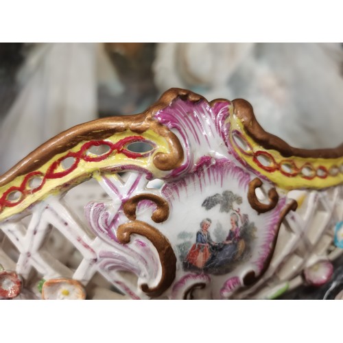 85 - A Meissen style continental figure group of a woman and child, the woman's arms supporting a pierced... 