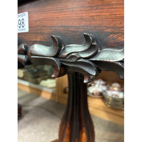 598 - A pair of William IV rosewood pedestal card tables, having a carved frieze above swept support on ci... 