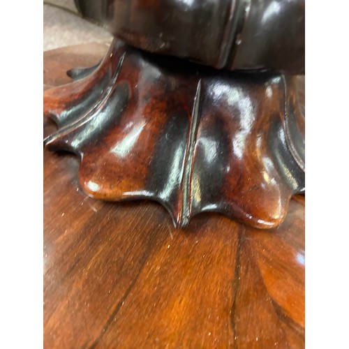 598 - A pair of William IV rosewood pedestal card tables, having a carved frieze above swept support on ci... 