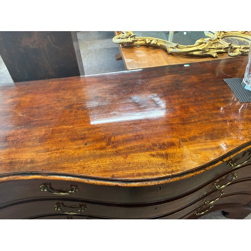 639 - A Regency mahogany serpentine chest of drawers, comprising four drawers with brass swan neck handles... 