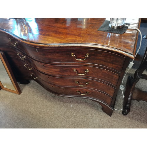 639 - A Regency mahogany serpentine chest of drawers, comprising four drawers with brass swan neck handles... 