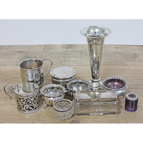 135 - A mixed lot of hallmarked silver comprising a mustard, four salts, a Christening tankard, a trinket ... 