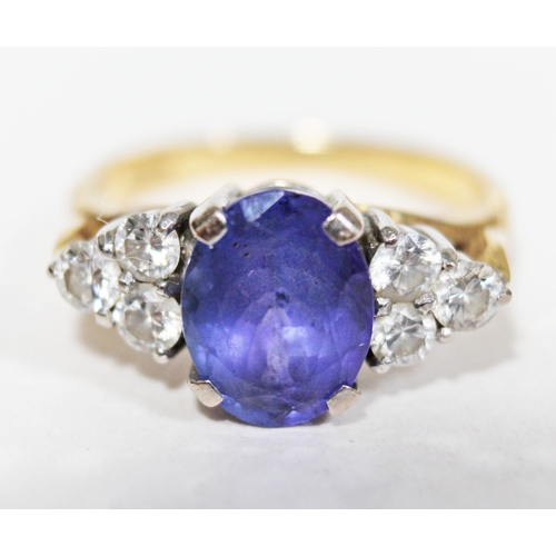 139 - A tanzanite and diamond ring, the oval cut central stone approx. 2.50 carats, set with diamond shoul... 