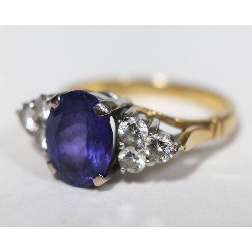 139 - A tanzanite and diamond ring, the oval cut central stone approx. 2.50 carats, set with diamond shoul... 