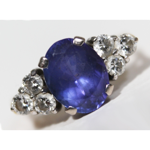 139 - A tanzanite and diamond ring, the oval cut central stone approx. 2.50 carats, set with diamond shoul... 