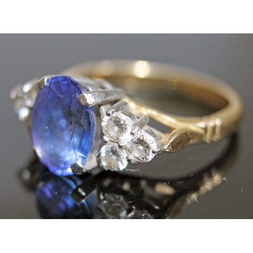 139 - A tanzanite and diamond ring, the oval cut central stone approx. 2.50 carats, set with diamond shoul... 