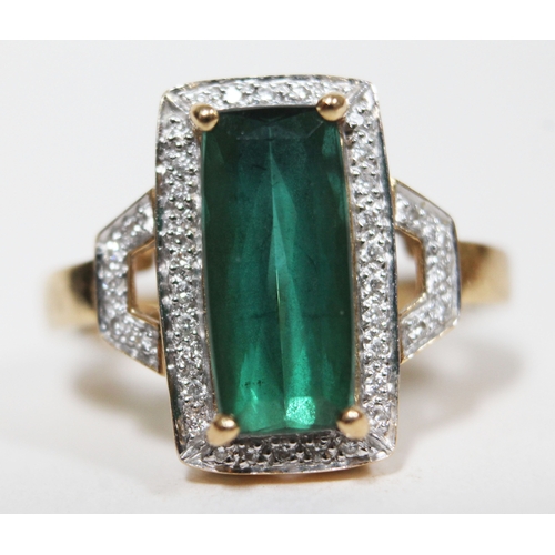 141 - A tourmaline and diamond ring, the central mid green stone approx. 2.90 carats, hallmarked 18ct gold... 