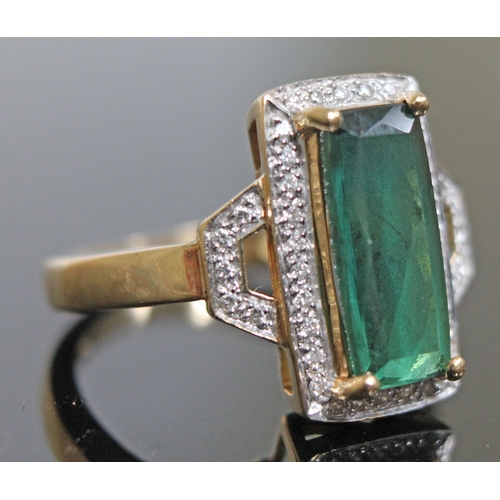 141 - A tourmaline and diamond ring, the central mid green stone approx. 2.90 carats, hallmarked 18ct gold... 