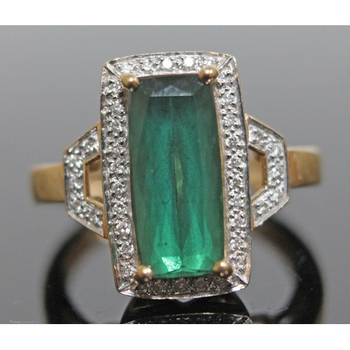 141 - A tourmaline and diamond ring, the central mid green stone approx. 2.90 carats, hallmarked 18ct gold... 