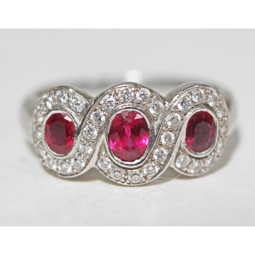 142 - A ruby and diamond ring, hallmarked 18ct white gold, gross wt. 6.4g, size N.