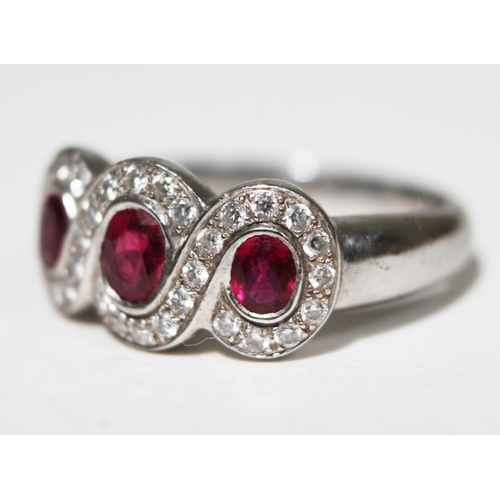 142 - A ruby and diamond ring, hallmarked 18ct white gold, gross wt. 6.4g, size N.