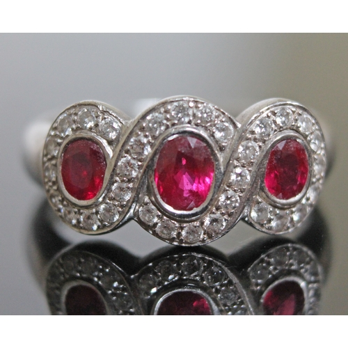 142 - A ruby and diamond ring, hallmarked 18ct white gold, gross wt. 6.4g, size N.