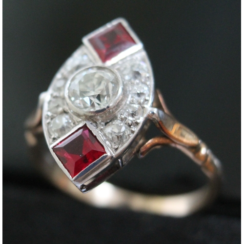 145 - An Art Deco diamond and ruby coloured stone ring, the central stone approx. 0.50 carats, yellow and ... 