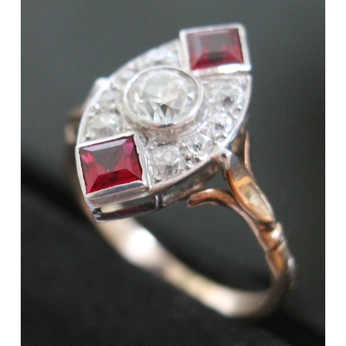 145 - An Art Deco diamond and ruby coloured stone ring, the central stone approx. 0.50 carats, yellow and ... 