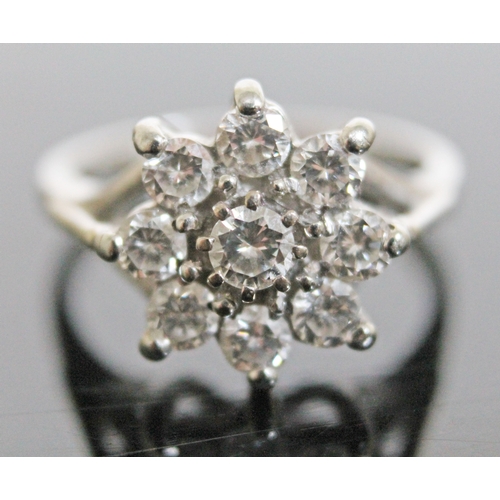 147 - A flower set diamond cluster ring, 9 stones gross wt. approx. 1 carat, hallmarked 18ct white gold ba... 