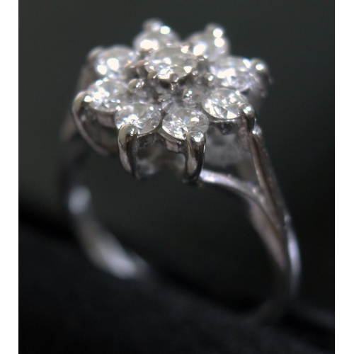 147 - A flower set diamond cluster ring, 9 stones gross wt. approx. 1 carat, hallmarked 18ct white gold ba... 