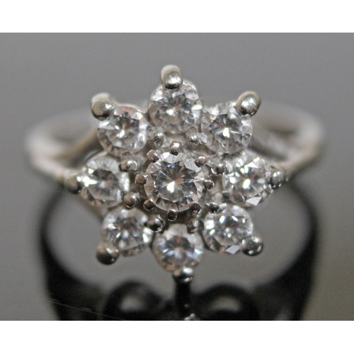 147 - A flower set diamond cluster ring, 9 stones gross wt. approx. 1 carat, hallmarked 18ct white gold ba... 