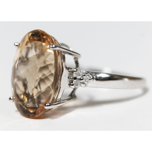 149 - A beryl and diamond ring, the central stone approx. 8 carats, diamond set shoulders, hallmarked 9ct ... 