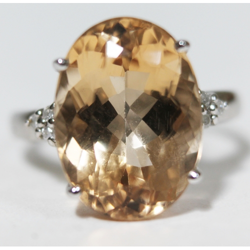 149 - A beryl and diamond ring, the central stone approx. 8 carats, diamond set shoulders, hallmarked 9ct ... 