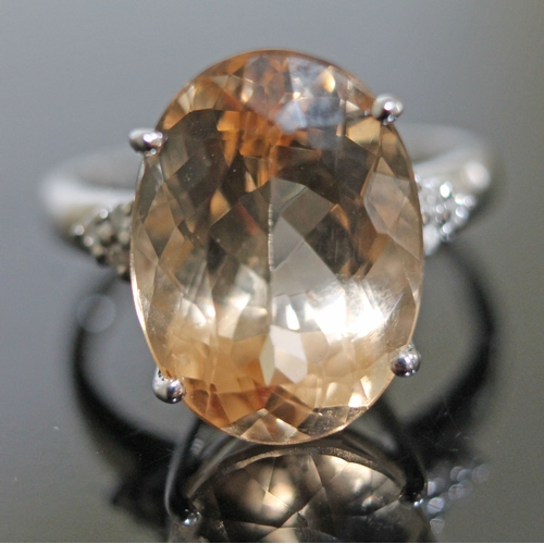 149 - A beryl and diamond ring, the central stone approx. 8 carats, diamond set shoulders, hallmarked 9ct ... 