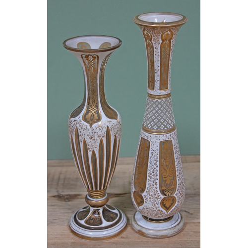 352 - Two Bohemian white over laid and gilt cut glass vase, height 26cm & 29cm.