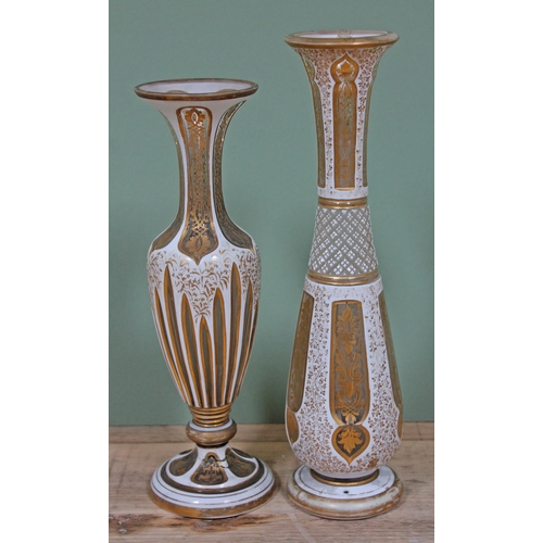 352 - Two Bohemian white over laid and gilt cut glass vase, height 26cm & 29cm.