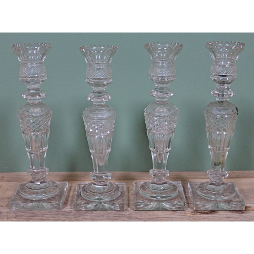 354 - A set of four cut glass candlesticks, height 24cm.