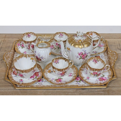 369 - An Aynsley tea set decorated in floral sprays and gilding comprising 5 cups, 6 saucers, milk, sugar,... 