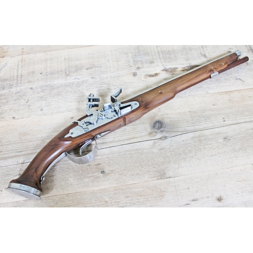 372 - A replica flintlock pistol, length 66cm.