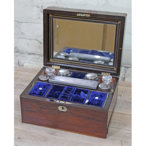 62 - A 19th Century rosewood sewing or work box, having blue velvet lined and tooled leather fitted inter... 