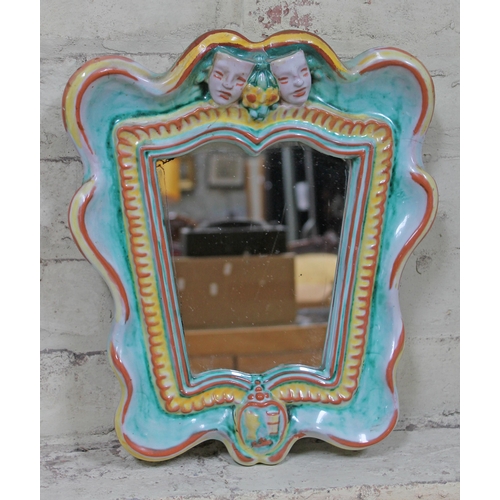 400 - An Austrian 1930s Art Deco pottery mirror with theatrical masks, Gmundner Karamik, length 37cm.